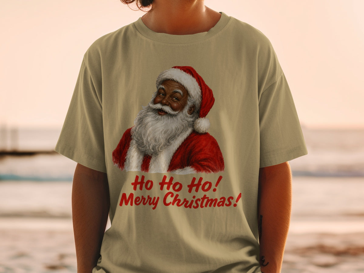 Santa Claus graphic with "Ho Ho Ho! Merry Christmas!" text on a tan t-shirt.