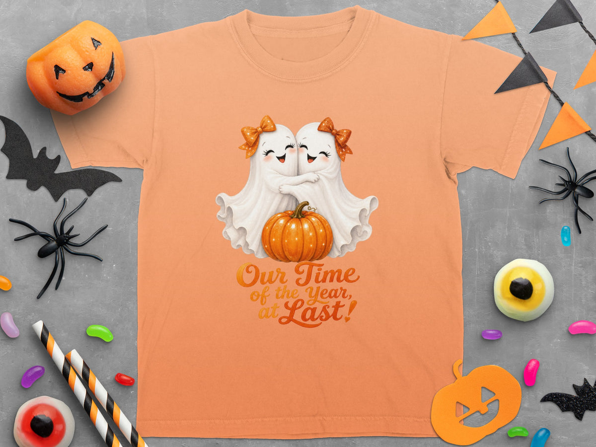 Orange t-shirt with two ghosts hugging a pumpkin and text "Our Time of the Year, at Last!".