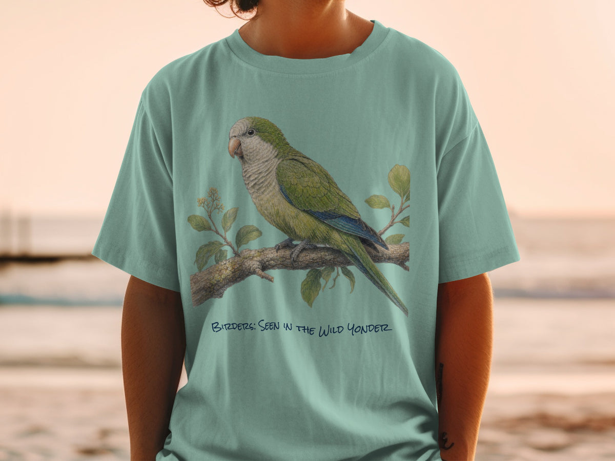 Teal t-shirt with green parrot on a branch and text "Birders: Seen in the Wild Yonder".