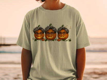 Three smiling pumpkins with curly gray hair and glasses on a green vine.