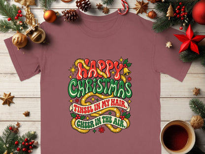 T-shirt with "Happy Christmas, Tinsel in My Hair, Cheer in the Air" text.
