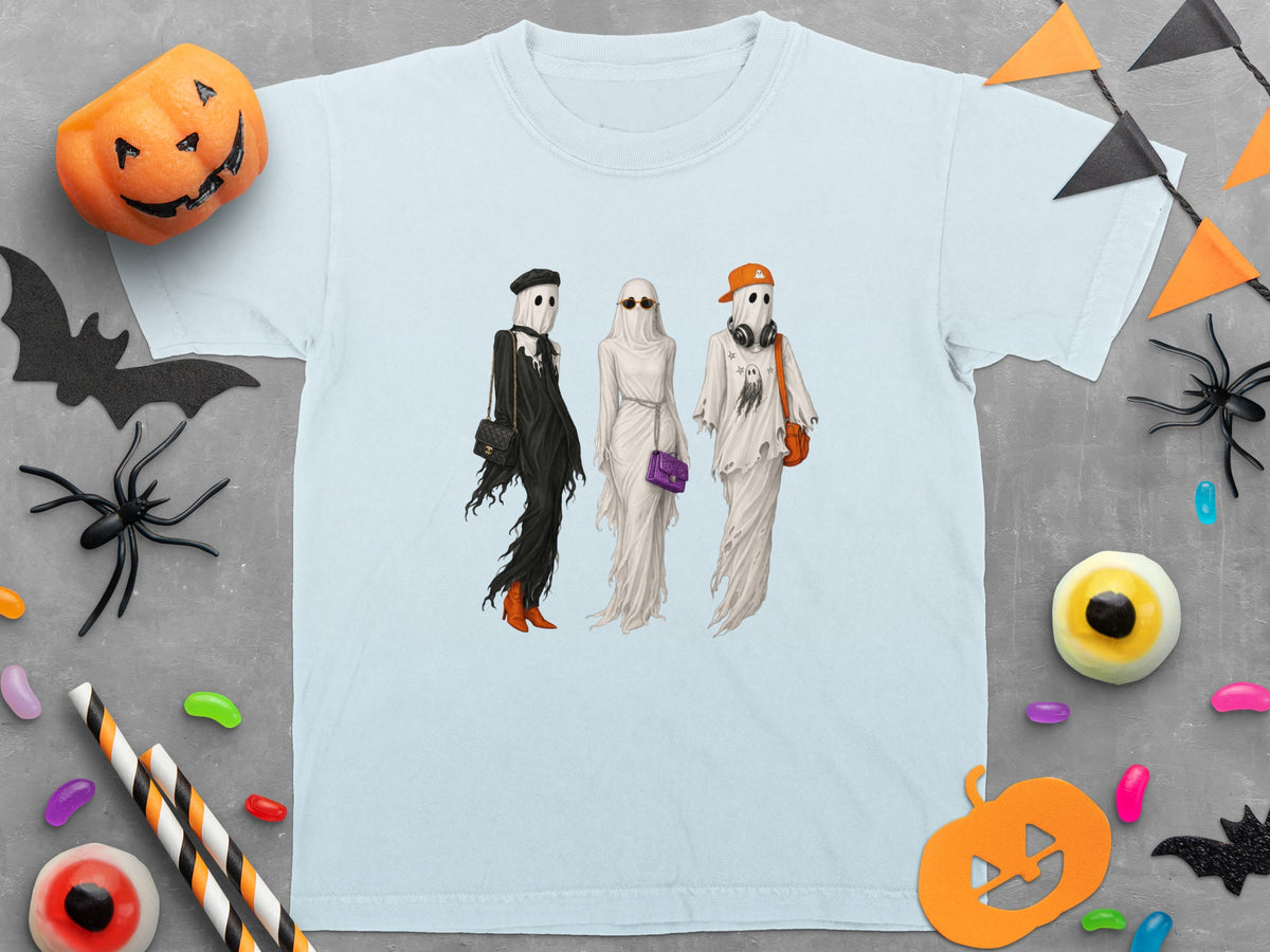 Light blue t-shirt featuring three ghosts dressed in fashion accessories.