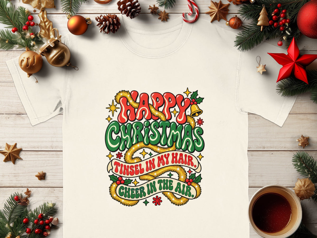 White t-shirt with "Happy Christmas, Tinsel in my hair, Cheer in the air" graphic.