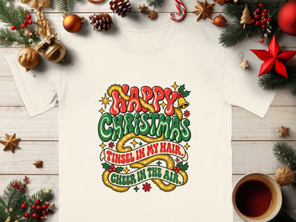 White t-shirt with "Happy Christmas, Tinsel in my hair, Cheer in the air" graphic.
