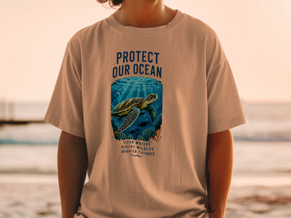 T-shirt with a sea turtle underwater illustration and text "Protect Our Ocean."