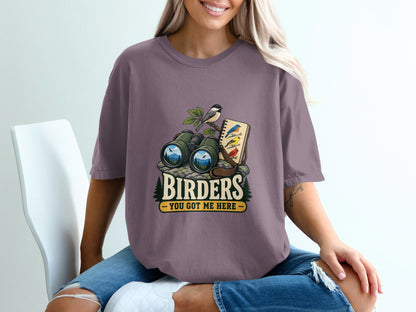 Binoculars and notebook with birds, text "BIRDERS YOU GOT ME HERE".