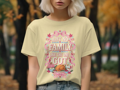 Yellow t-shirt with "Ain't no family like the one I got" text and Thanksgiving food illustration.