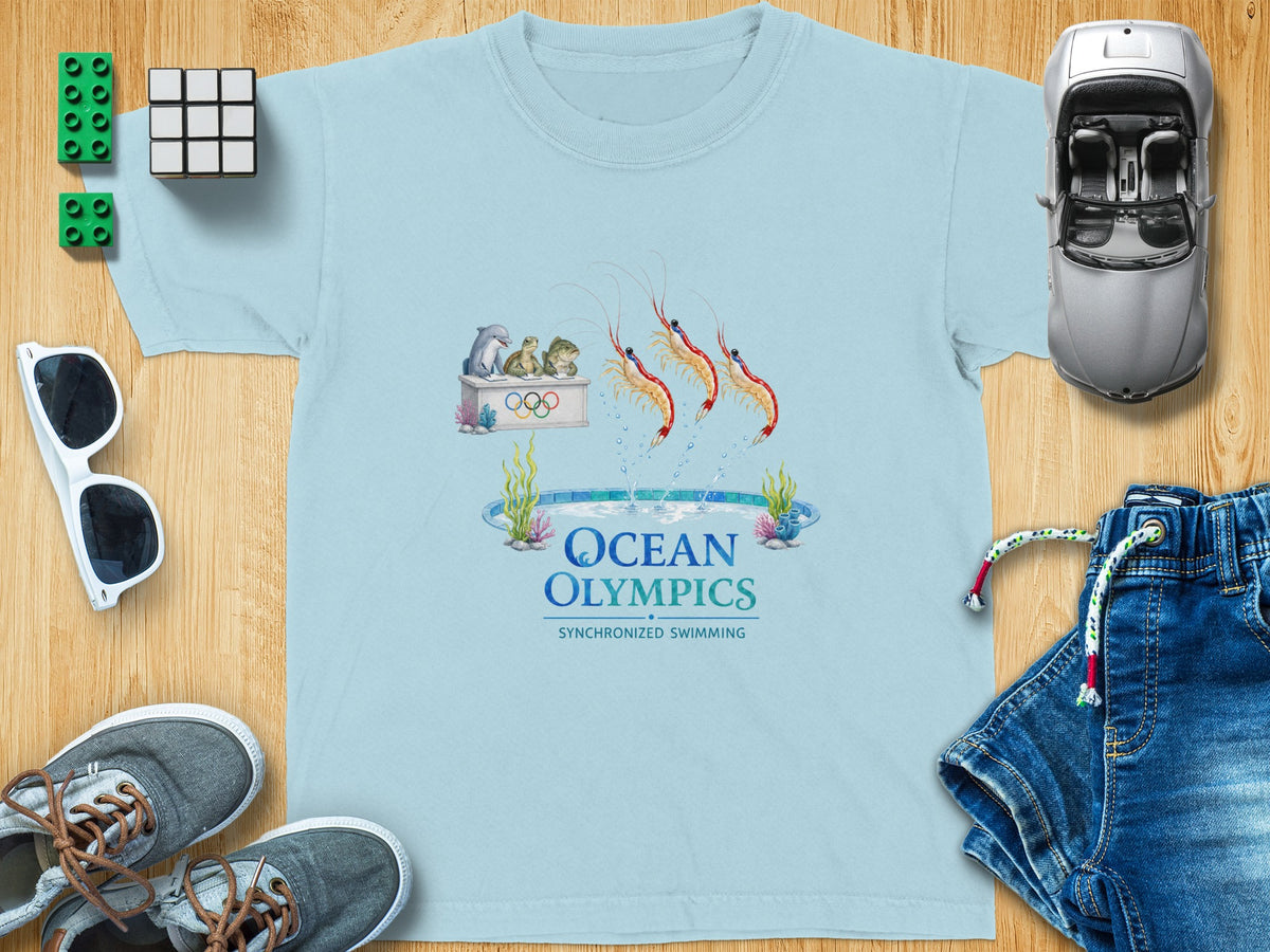 Light blue t-shirt with "Ocean Olympics" and synchronized swimming animals graphic.