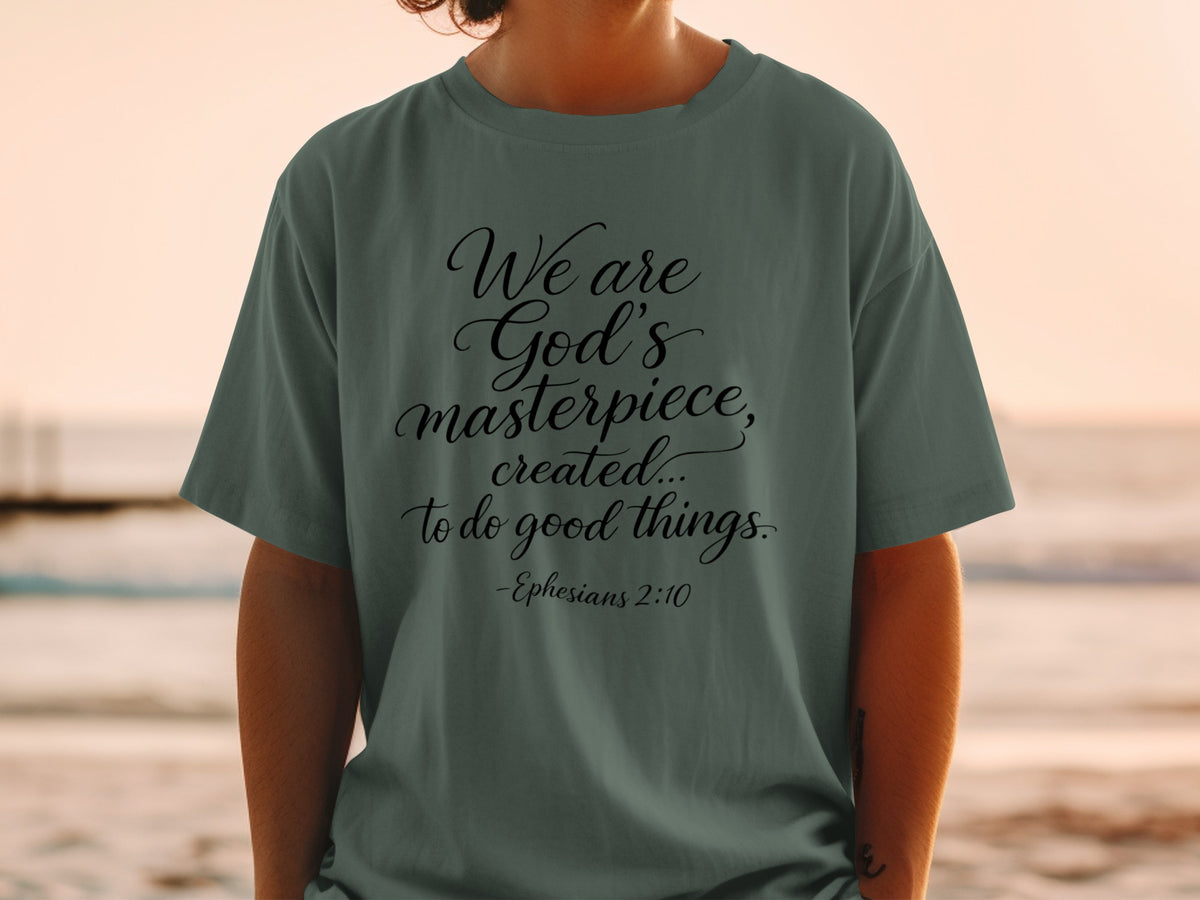 Green t-shirt with black text reading "We are God's masterpiece, created... to do good things. -Ephesians 2:10"