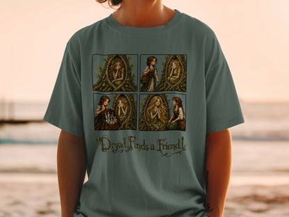 T-shirt features four panels of a dryad in a tree and text reading "Dryad Finds a Friend!".