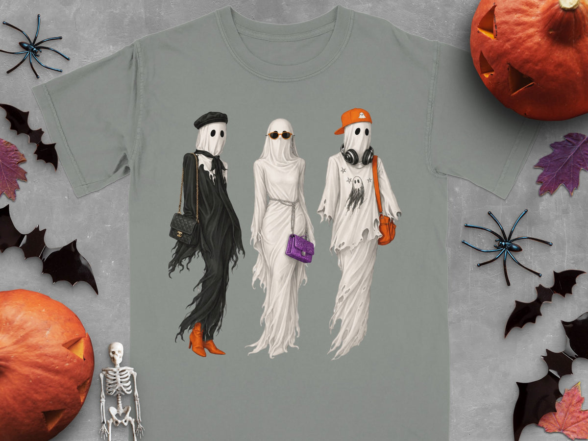 Three fashionable ghosts with accessories, displayed on a grey t-shirt.