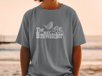 T-shirt with white graphic of a bird and binoculars, text reads "The BirdWatcher."