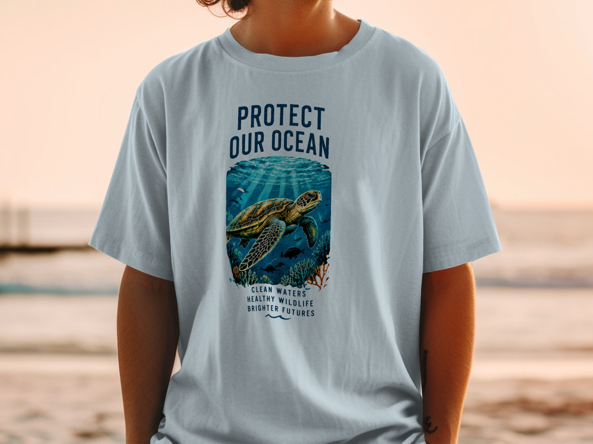 Light blue t-shirt with a sea turtle graphic and text "Protect Our Ocean".