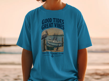 T-shirt graphic with text "GOOD TIDES GREAT VIBES" and a fishing boat scene.