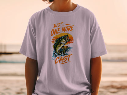 T-shirt graphic with bass jumping, sun, water splash, and text "JUST ONE MORE CAST."