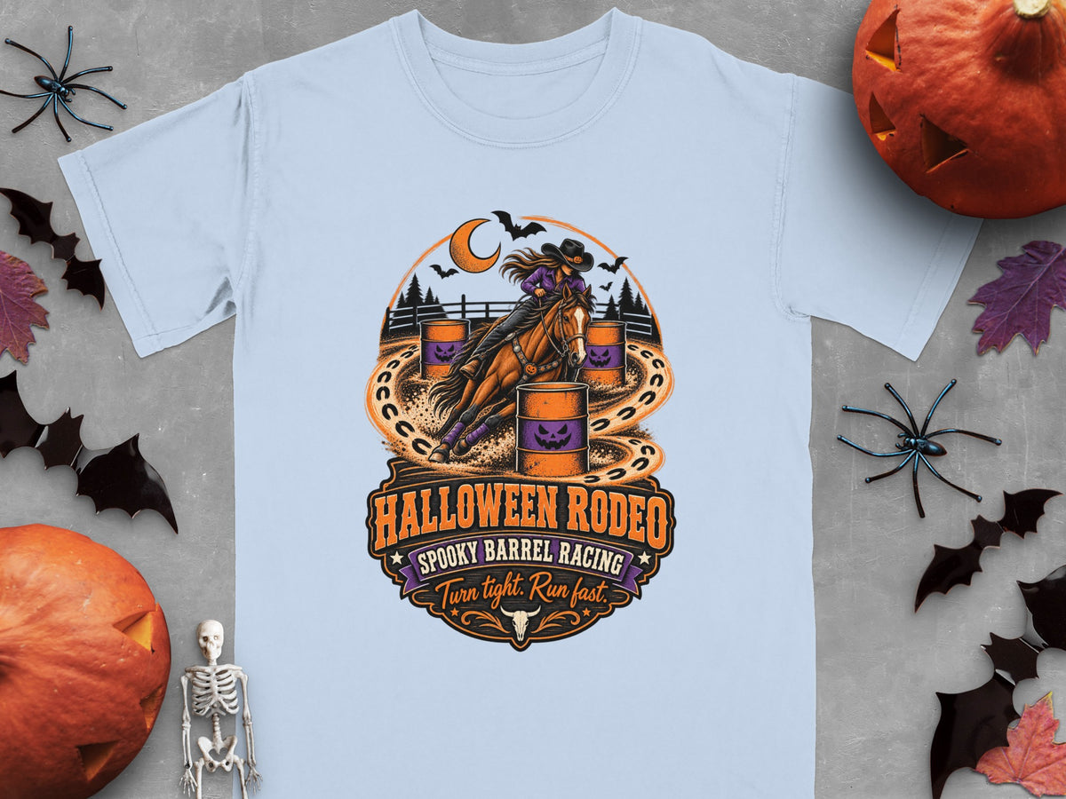 Light blue t-shirt with Halloween Rodeo spooky barrel racing graphic.