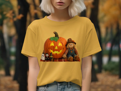 Yellow t-shirt with a Halloween graphic of a scarecrow, pumpkin, and spooky characters.