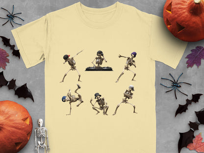 Six skeleton dancers in various hip-hop poses on a pale yellow t-shirt.