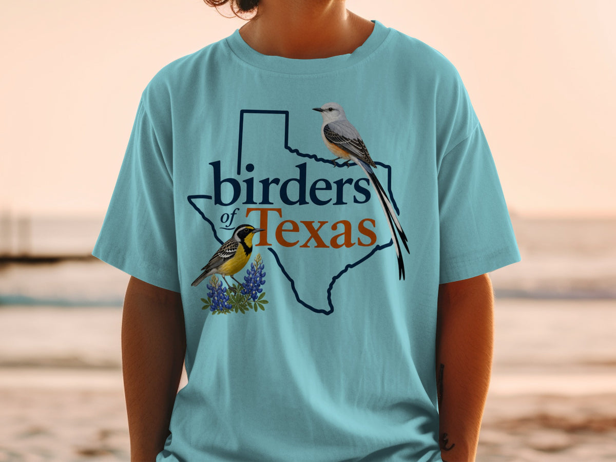 Turquoise t-shirt with Texas outline, text "birders of Texas", and two birds.