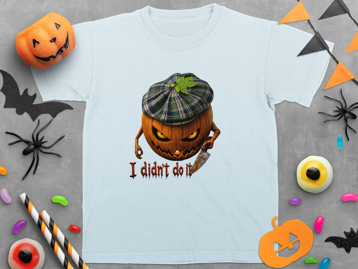 Light blue t-shirt with a Halloween graphic of a pumpkin holding a knife and the text "I didn't do it".