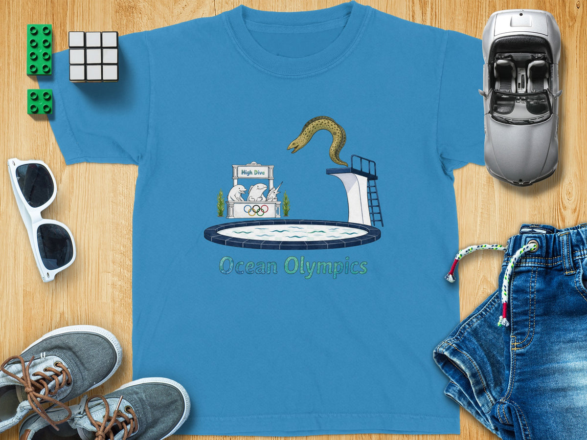 Blue t-shirt graphic with cartoon eel on diving board and text "Ocean Olympics".