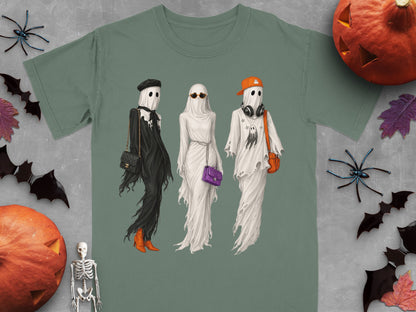 Three ghosts dressed in fashionable outfits with Halloween decorations.