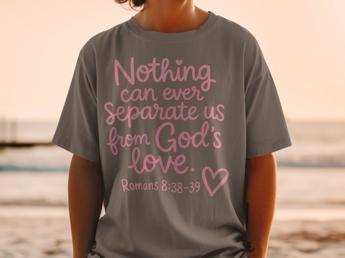Gray t-shirt with pink text "Nothing can ever separate us from God's love. Romans 8:38-39"