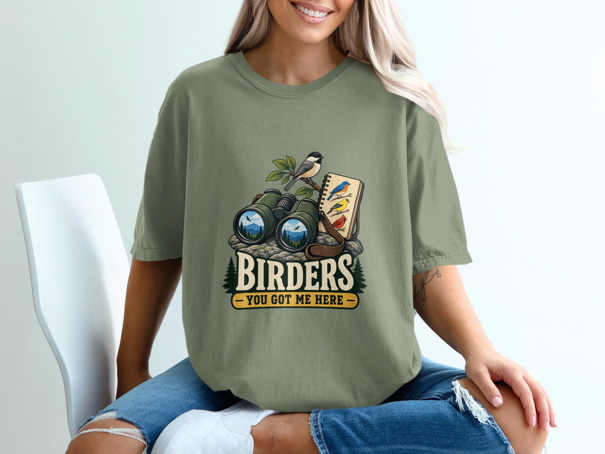 Binoculars, notebook, and birds graphic with text "BIRDERS YOU GOT ME HERE".