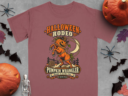T-shirt with Halloween Rodeo and Pumpkin Wrangler graphic.