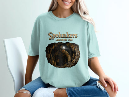 Light blue t-shirt with "Spelunkers Light up the Dark" and cave graphic.