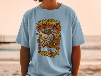 Light blue t-shirt with retro Thanksgiving graphic featuring gravy boat and text.