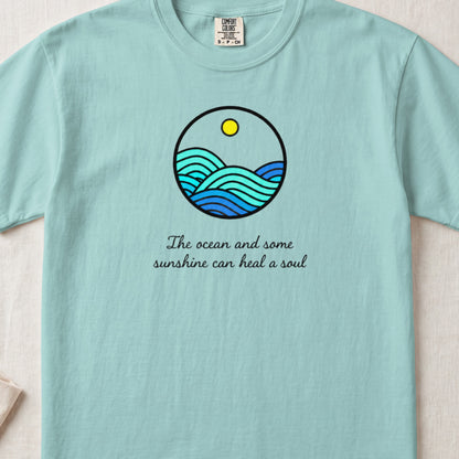Light blue t-shirt with a round ocean graphic and the text The ocean and some sunshine can heal a soul