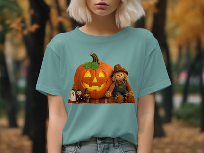 Jack-o'-lantern, scarecrow, witch, and ghost graphic on teal t-shirt