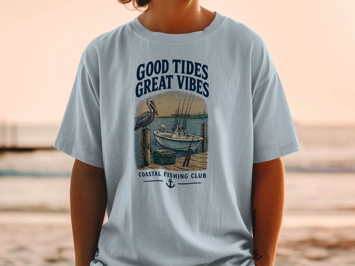 Light blue t-shirt with "Good Tides Great Vibes" and coastal fishing club graphic.