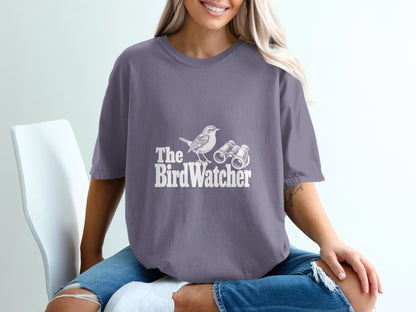 T-shirt with "The BirdWatcher" text, a bird, and binoculars graphic.