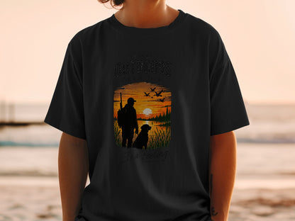 Black t-shirt with silhouette of hunter, dog, and sunset scene.