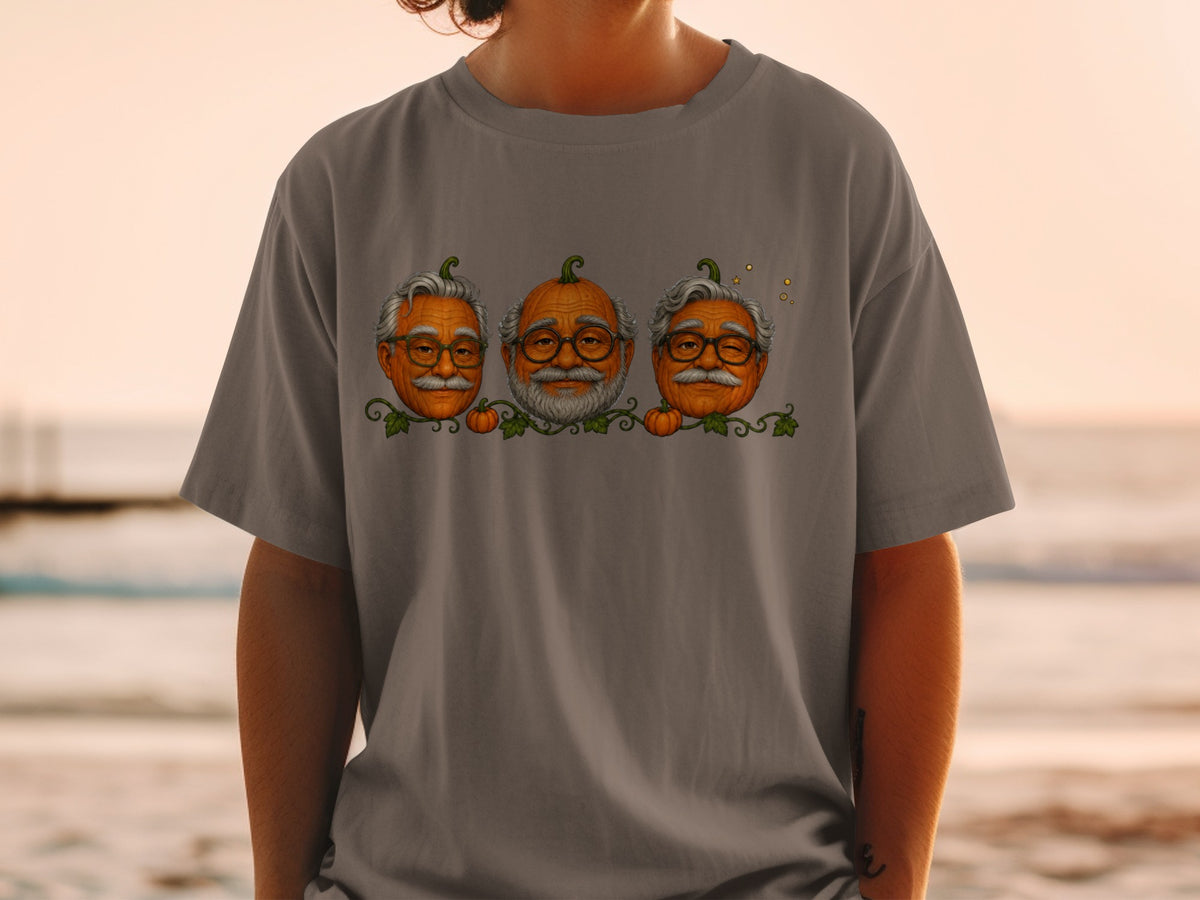 T-shirt with three pumpkins with glasses and mustaches in a vine pattern.