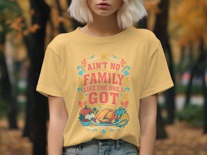 Yellow t-shirt with "Ain't No Family Like The One I Got" text and Thanksgiving graphics.
