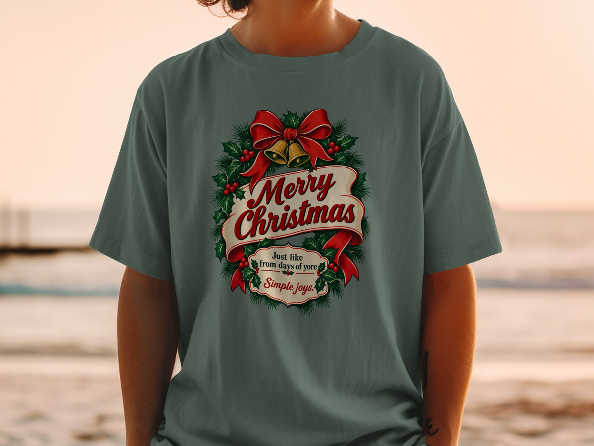 Green t-shirt with "Merry Christmas" and festive holly and bells design.