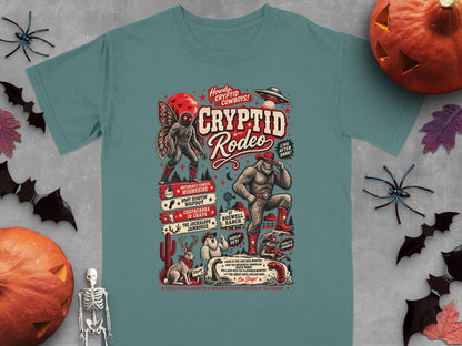 Cryptid Rodeo design featuring Bigfoot, Mothman, Jackalope, and UFO with event details.