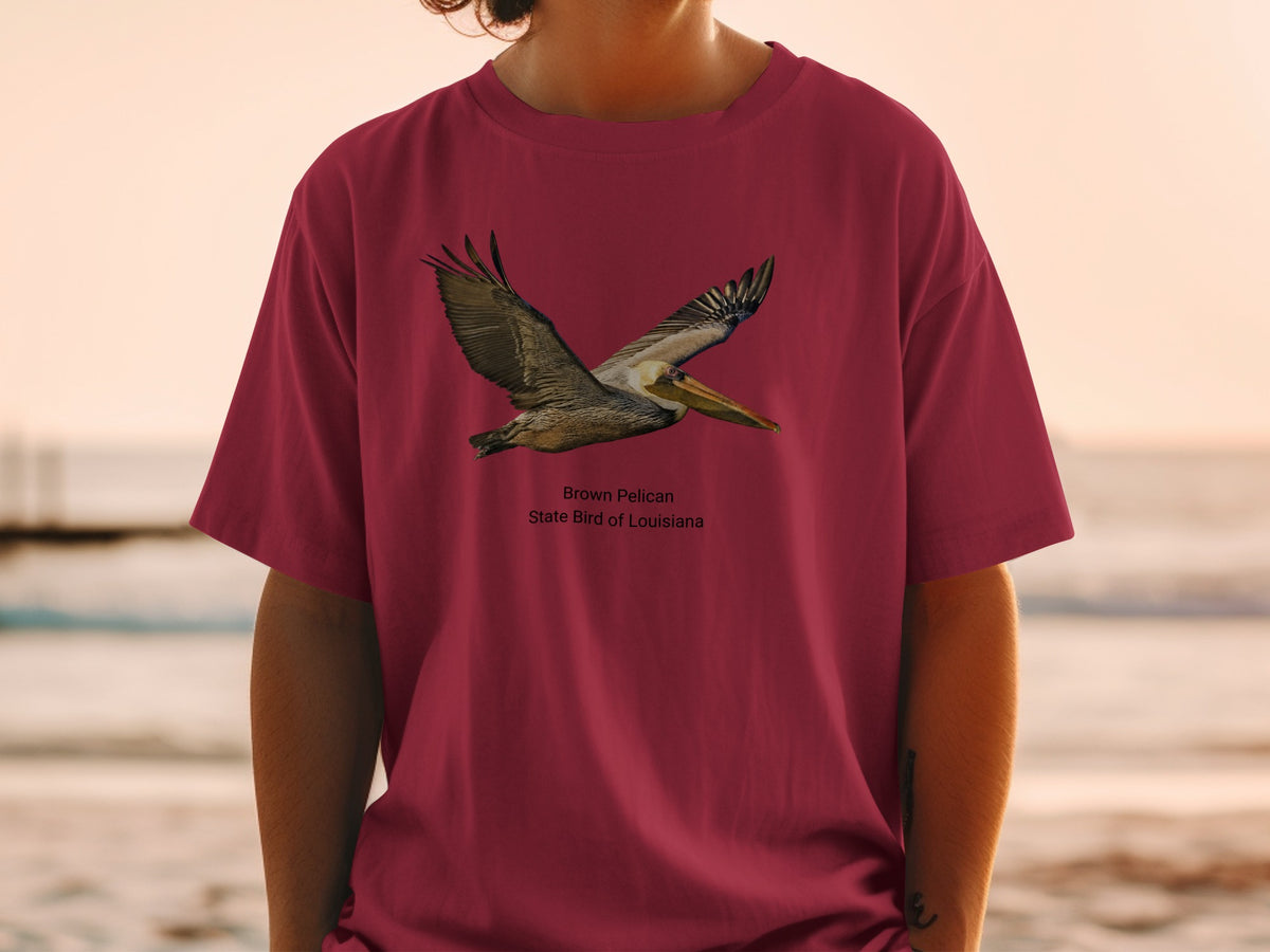Brown Pelican, State Bird of Louisiana graphic on a maroon t-shirt.