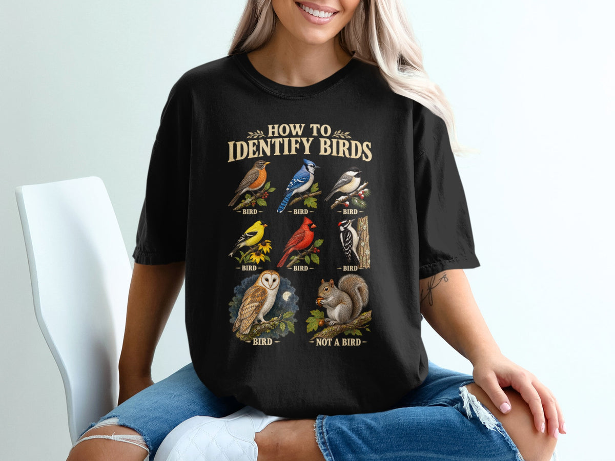 Black t-shirt with "How to Identify Birds" text and illustrations of various birds.
