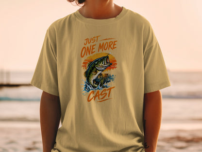 T-shirt graphic with leaping bass, sunset, and text "JUST ONE MORE CAST."