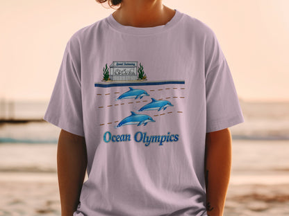 Three dolphins swim past a "Speed Swimming" stand with sea creatures, text "Ocean Olympics".