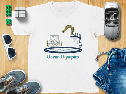 White t-shirt with "Ocean Olympics" text and a diving eel illustration.
