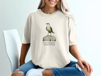 Northern Mockingbird, State Bird of Florida graphic on cream t-shirt.