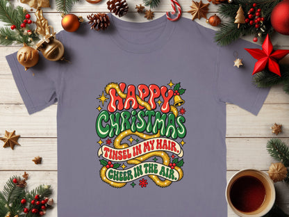 Purple t-shirt with "Happy Christmas, Tinsel in My Hair, Cheer in the Air" text.