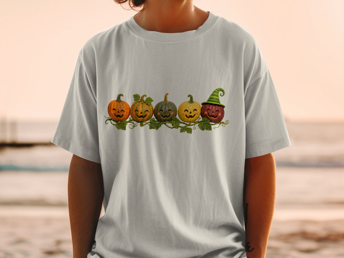 Five cartoon pumpkins with faces and vines, one wearing a green witch hat.