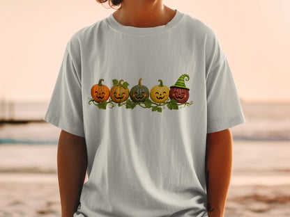 Five cartoon pumpkins with faces and vines, one wearing a green witch hat.