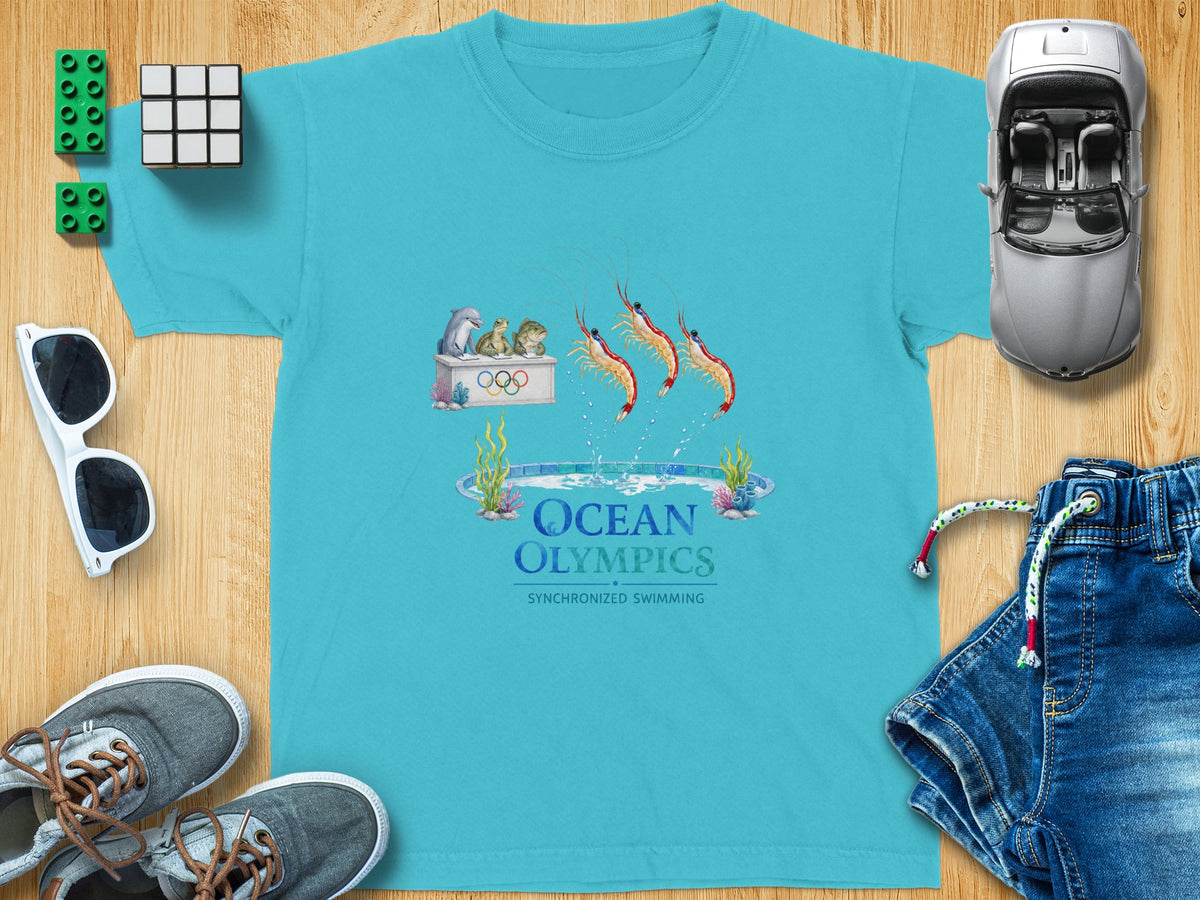 Turquoise t-shirt with "Ocean Olympics Synchronized Swimming" graphic of shrimp and sea animals.